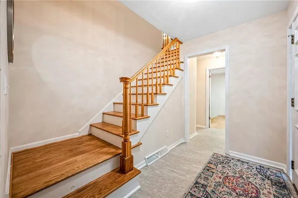 a view of entryway with wooden floor