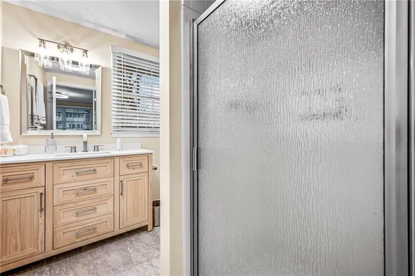 a bathroom with a sink a mirror and a window