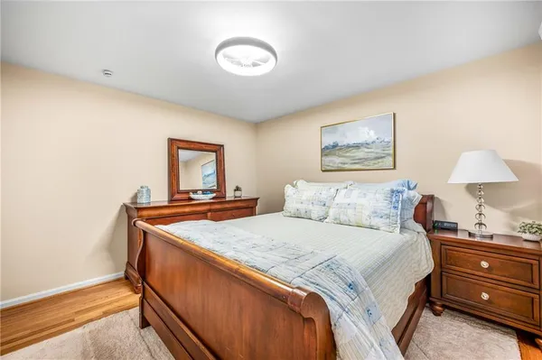 a bedroom with bed and window