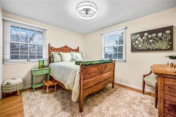 a bed room with a bed and a chair