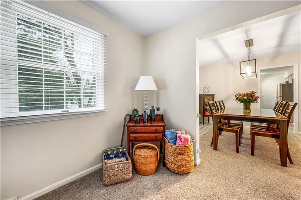 a view of a room that has a bed and a window