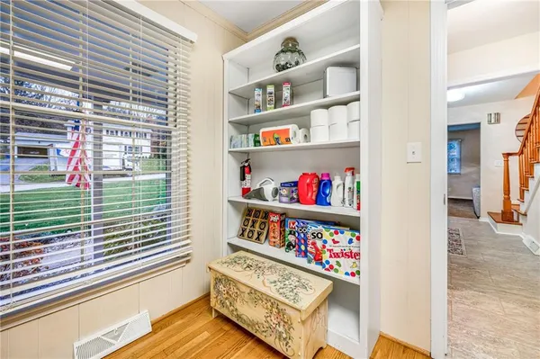 a view of a book shelf of the house