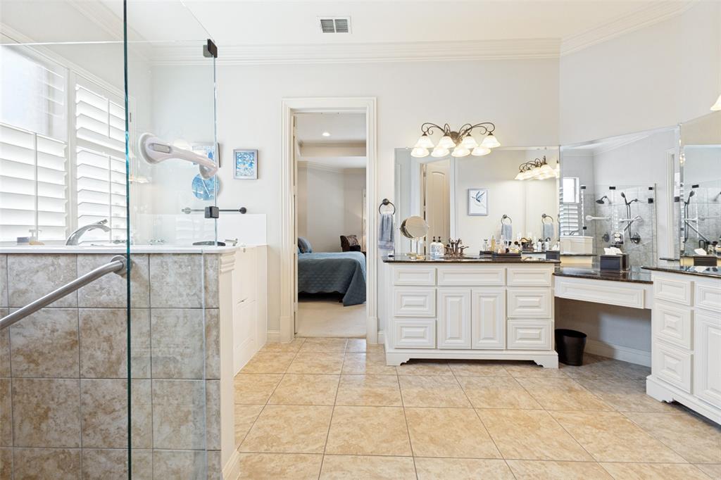 971 Elk Ridge Road Prosper, TX 75078 - Photo 14 of 29 Oversized primary bath with shower and an amazing walk in bathtub.