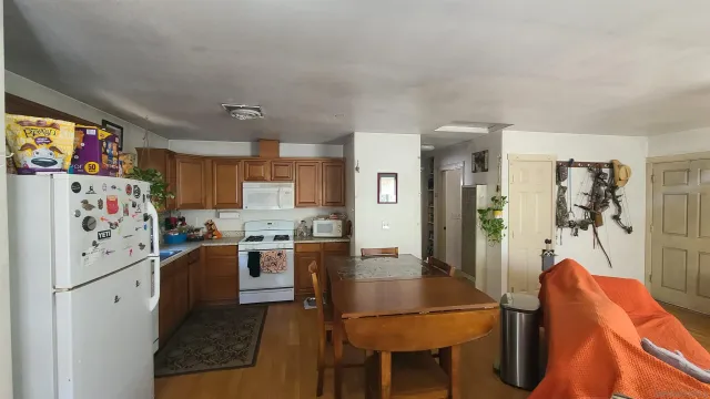 a bed room with furniture and wooden floor