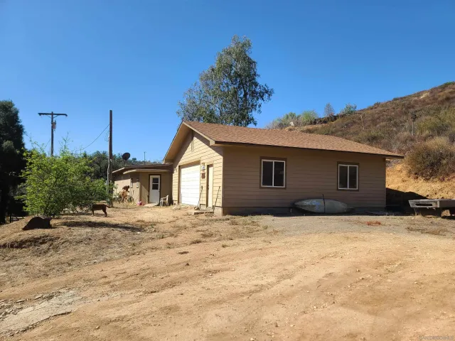 a house with trees in the background