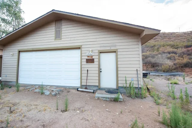 a view of a backyard of the house