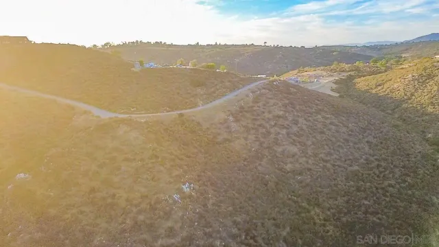 a view of a pathway with a yard