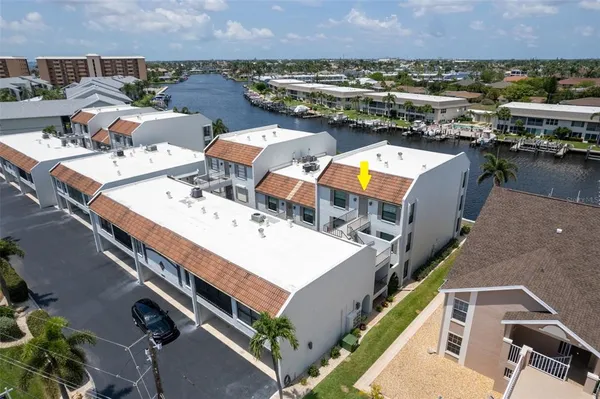 an aerial view of a house with a ocean view
