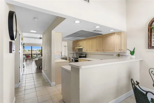 a kitchen with granite countertop a sink stainless steel appliances and cabinets