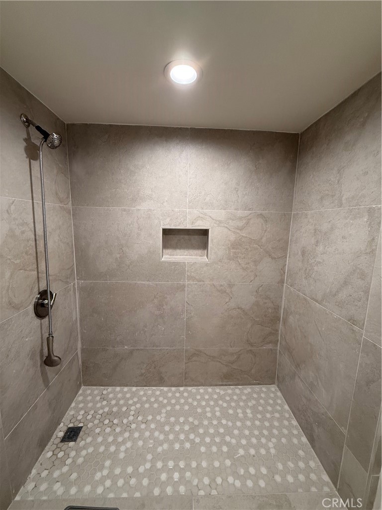 6538 Kelvin Avenue Winnetka, CA 91306 - Photo 14 of 20 a bathroom with a shower