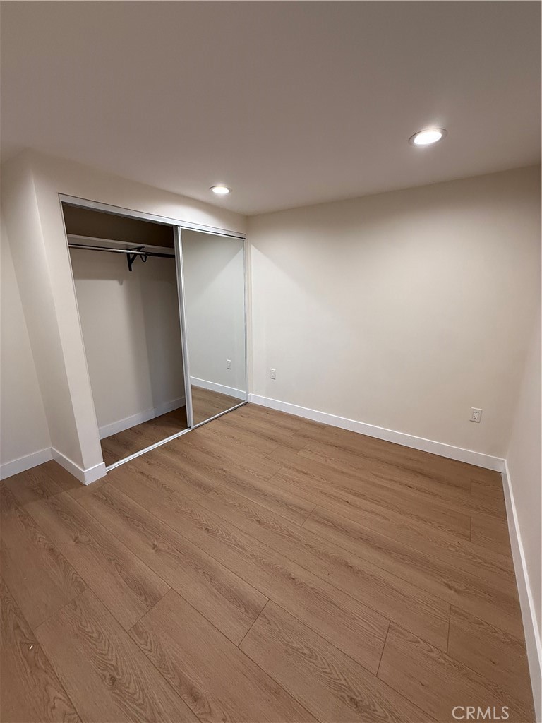 6538 Kelvin Avenue Winnetka, CA 91306 - Photo 17 of 20 a view of empty room with wooden floor and fan