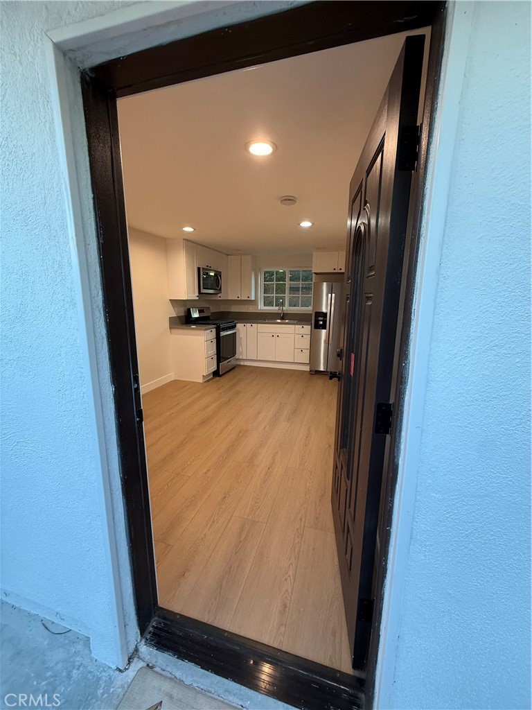 6538 Kelvin Avenue Winnetka, CA 91306 - Photo 5 of 20 a view of a living room with a large window
