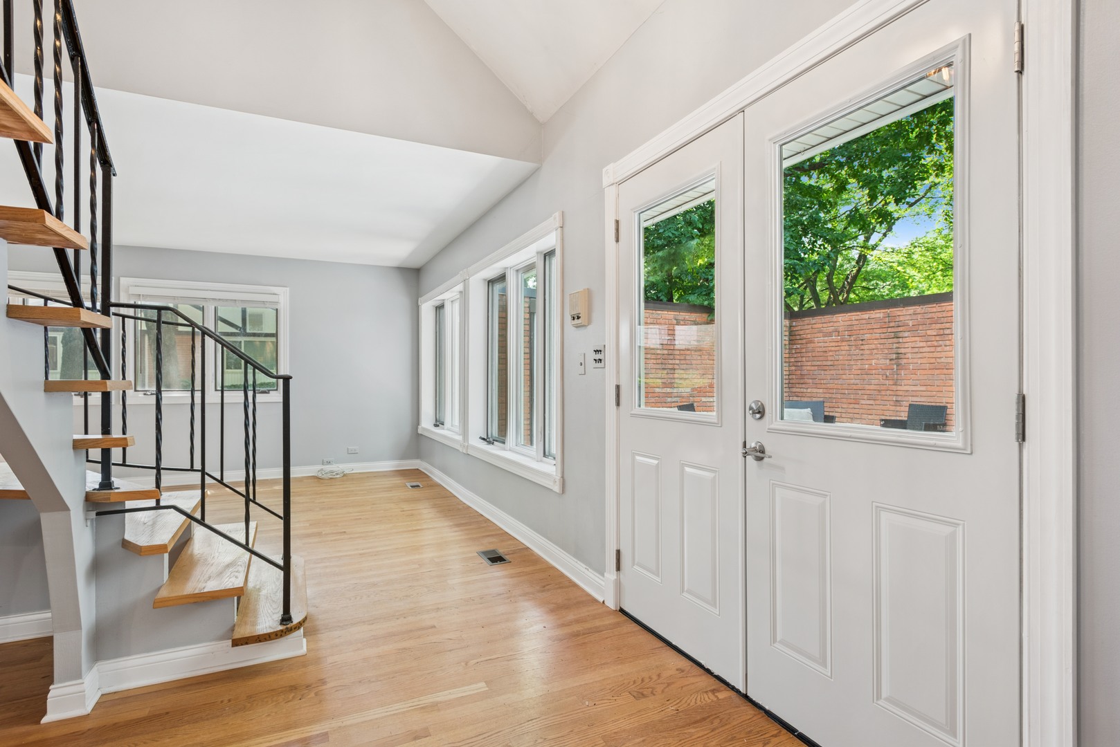 2 Croyden On Duxbury Rolling Meadows, IL 60008 - Photo 4 of 24 a view of an entryway with wooden floor and door