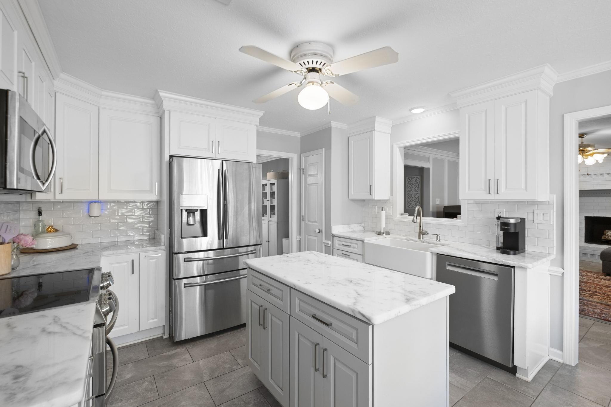 3353 Beaver Run Cove North Collierville, TN 38017 - Photo 11 of 34 a kitchen with a sink stove and refrigerator