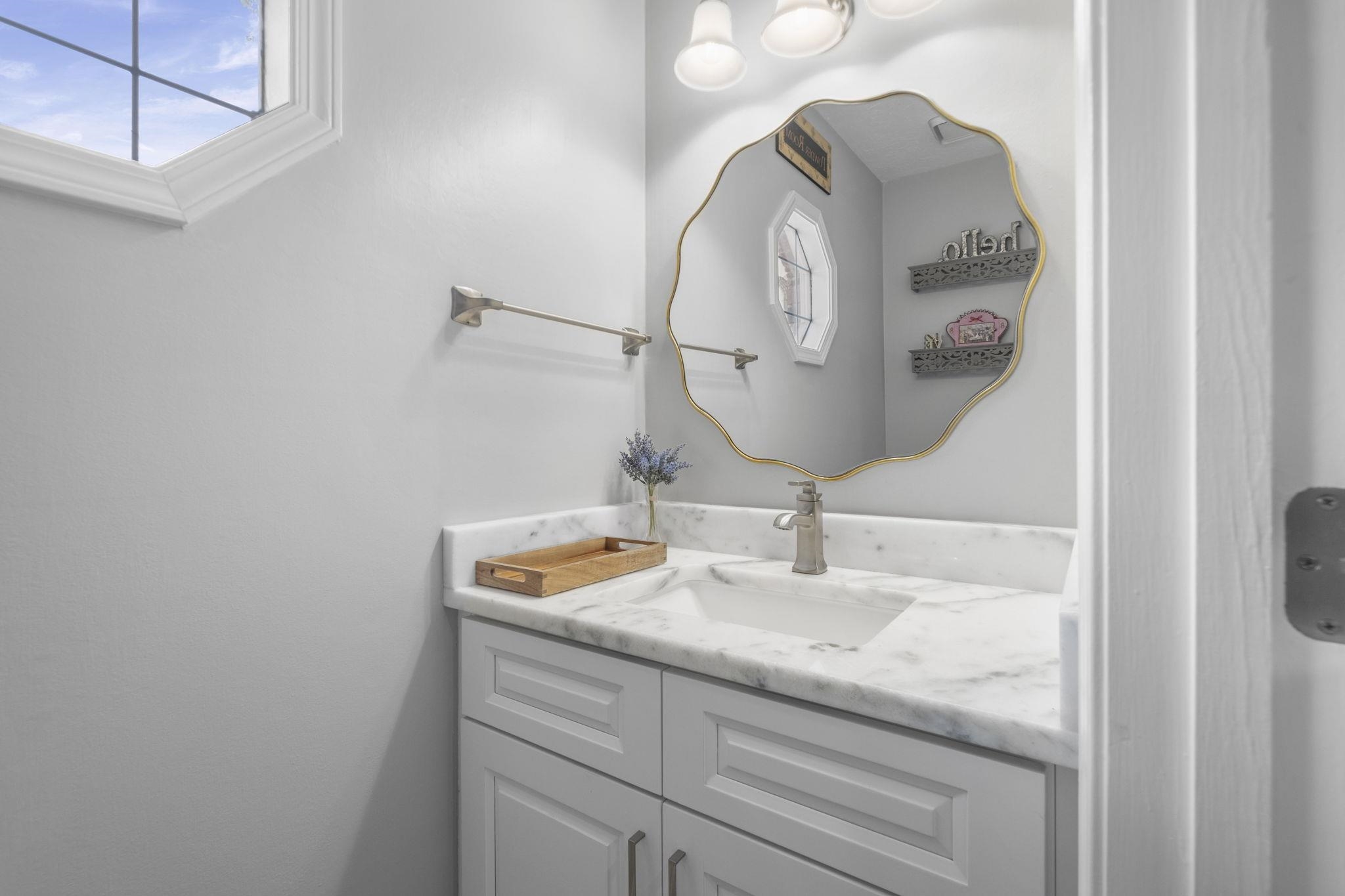 3353 Beaver Run Cove North Collierville, TN 38017 - Photo 17 of 34 a bathroom with a sink and a mirror