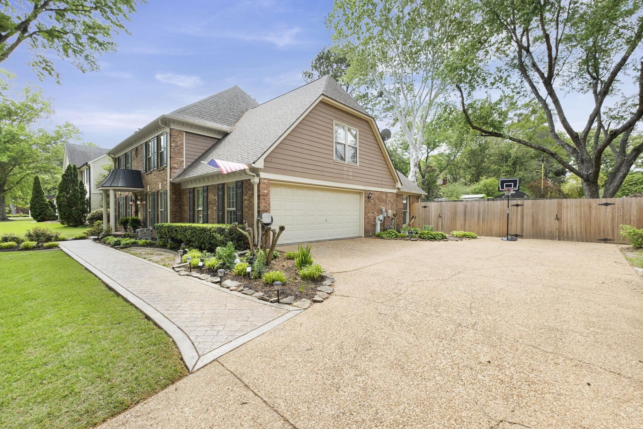 3353 Beaver Run Cove North Collierville, TN 38017 - Photo 2 of 34 a front view of a house with a yard and a garage