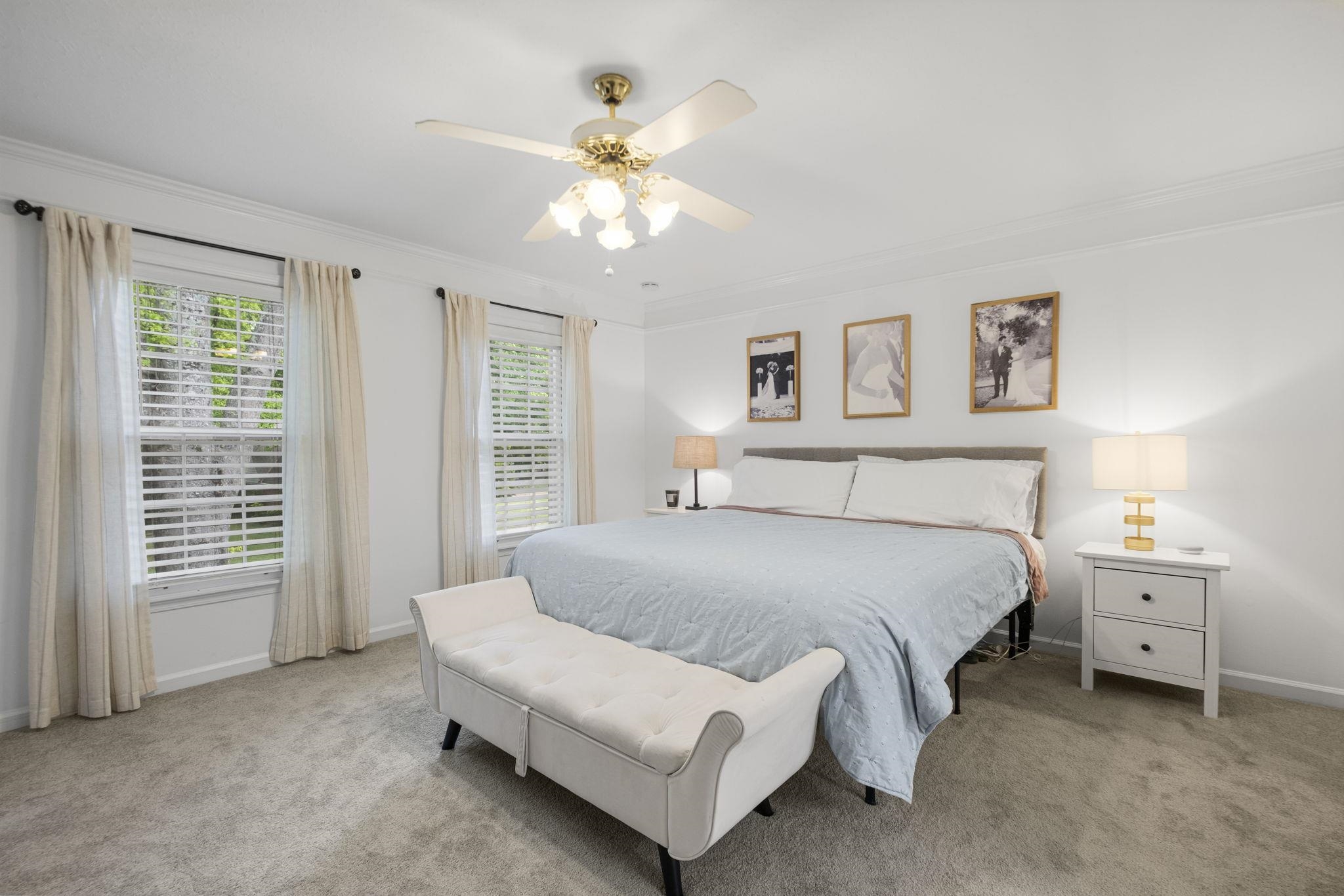 3353 Beaver Run Cove North Collierville, TN 38017 - Photo 21 of 34 a spacious bedroom with a bed and a chandelier