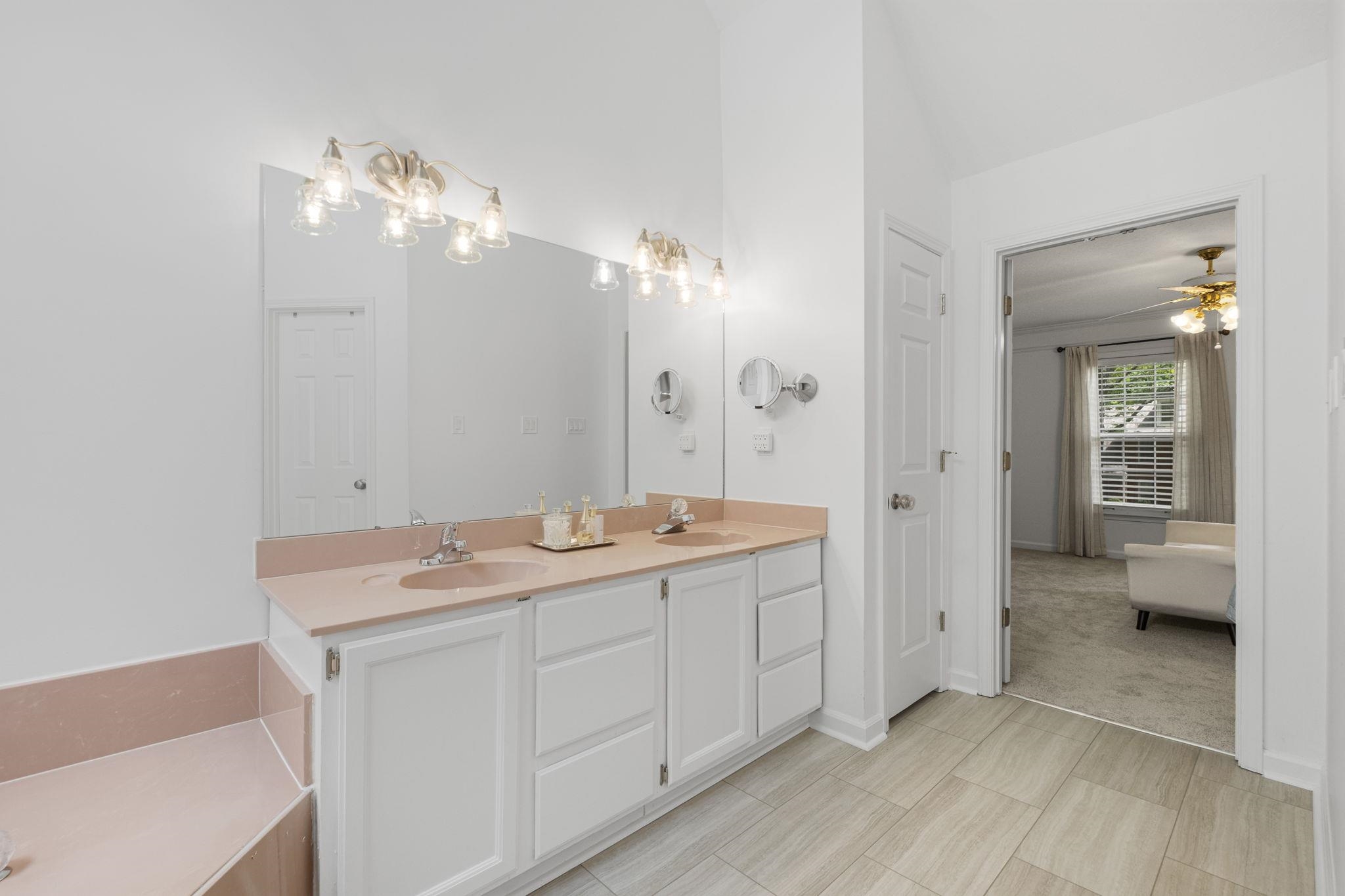 3353 Beaver Run Cove North Collierville, TN 38017 - Photo 22 of 34 a spacious bathroom with a shower a sink and a mirror