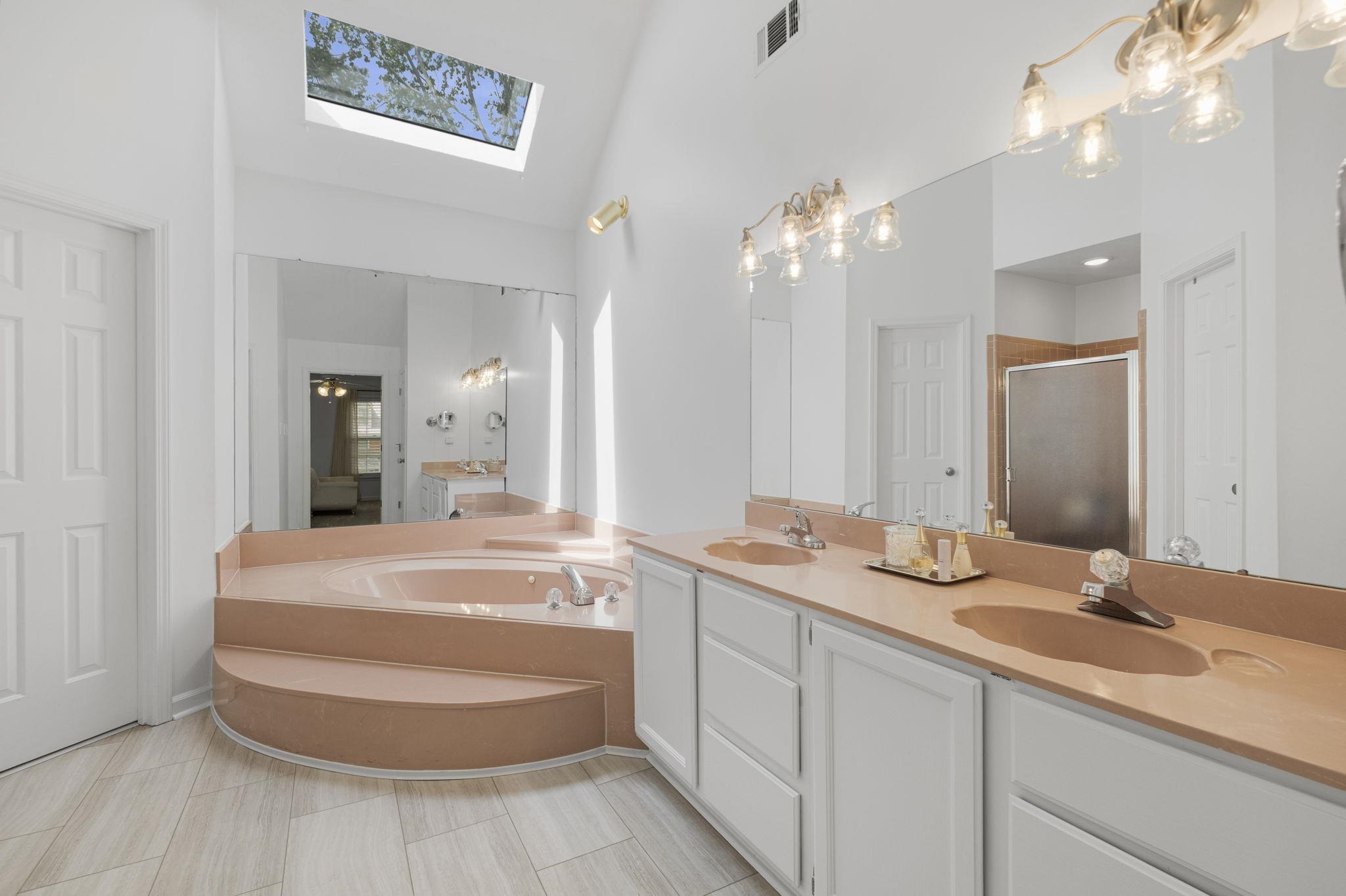 3353 Beaver Run Cove North Collierville, TN 38017 - Photo 23 of 34 a spacious bathroom with a double vanity sink mirror and