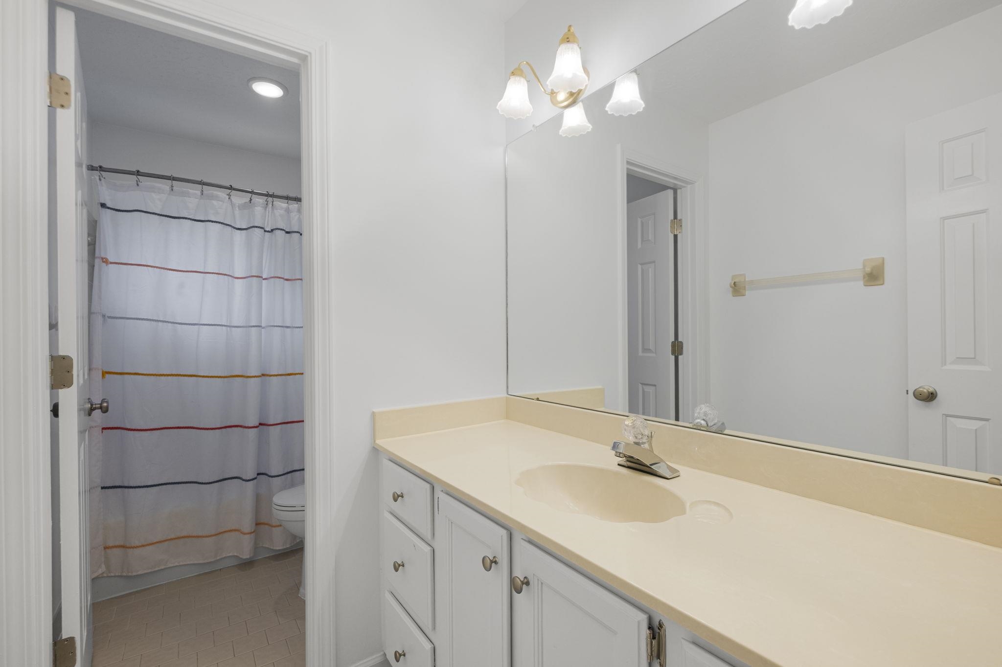 3353 Beaver Run Cove North Collierville, TN 38017 - Photo 26 of 34 a bathroom with a sink and a mirror