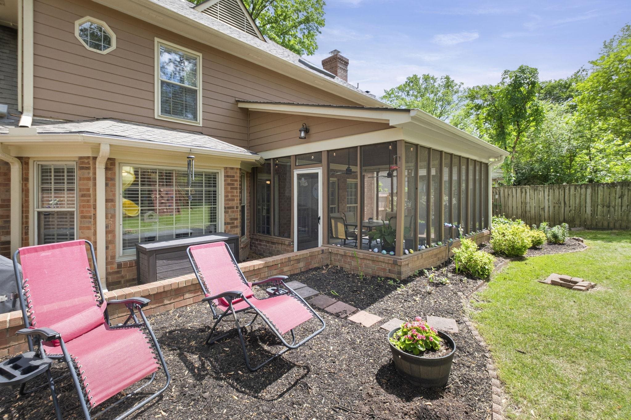 3353 Beaver Run Cove North Collierville, TN 38017 - Photo 29 of 34 a view of a chair and tables in backyard of the house