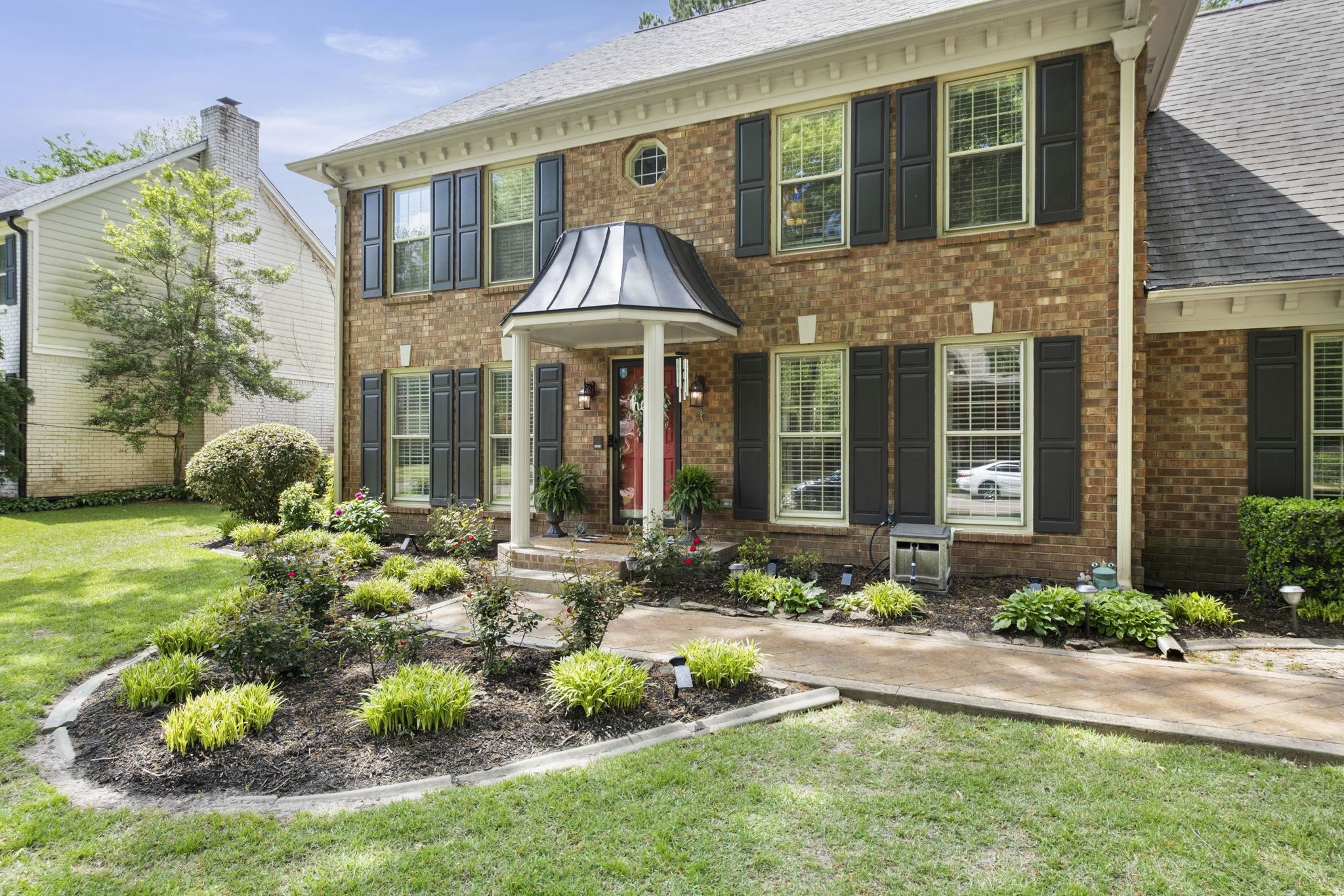 3353 Beaver Run Cove North Collierville, TN 38017 - Photo 34 of 34 a front view of a house with a garden and plants