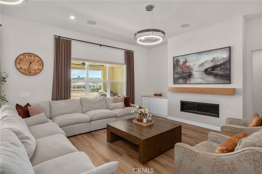 16155 New Canaan Court Riverside, CA 92504 - Photo 17 of 26 a living room with furniture and a large window
