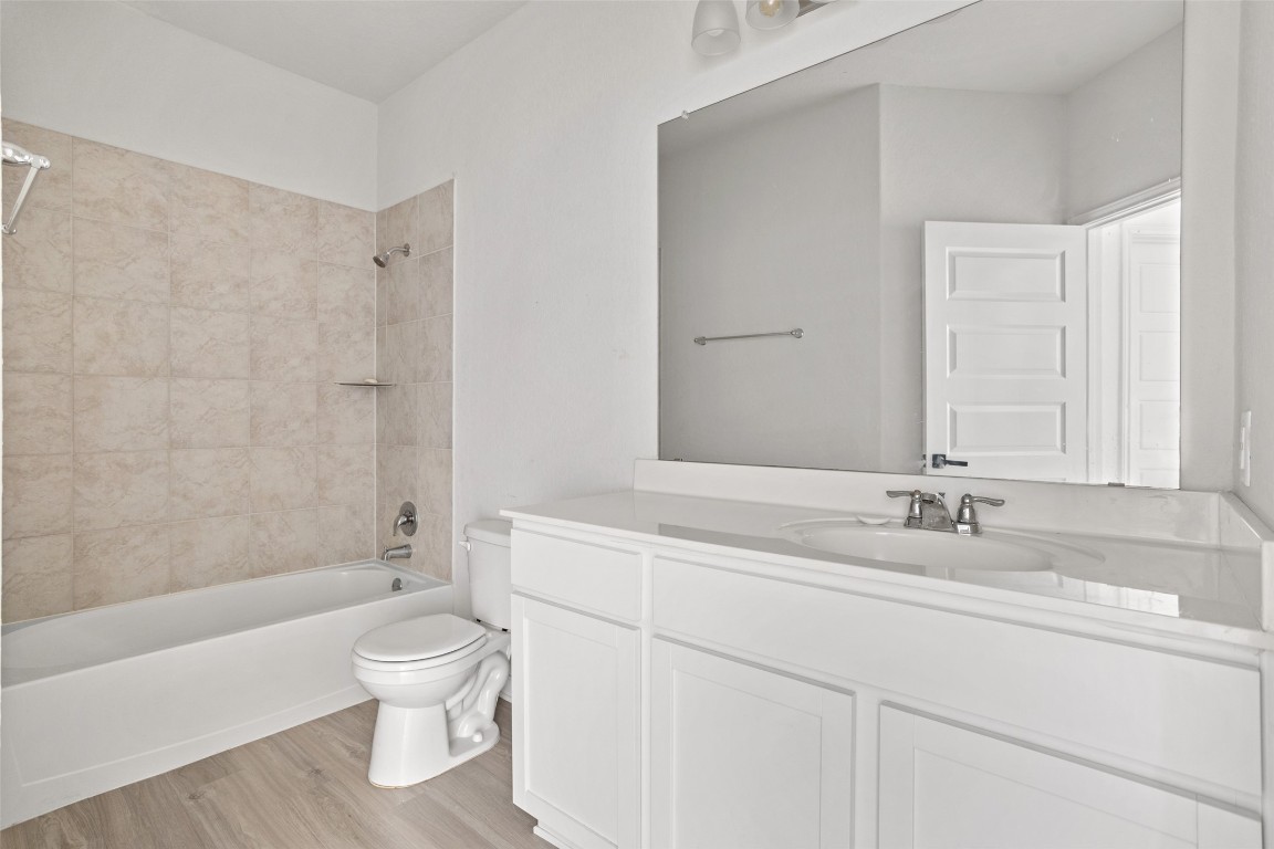 3409 Copper Acres Bulverde, TX 78163 - Photo 18 of 23 a bathroom with a sink toilet and shower