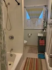 a bathroom with a bathtub and shower