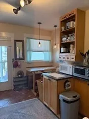 a kitchen with a stove and a sink