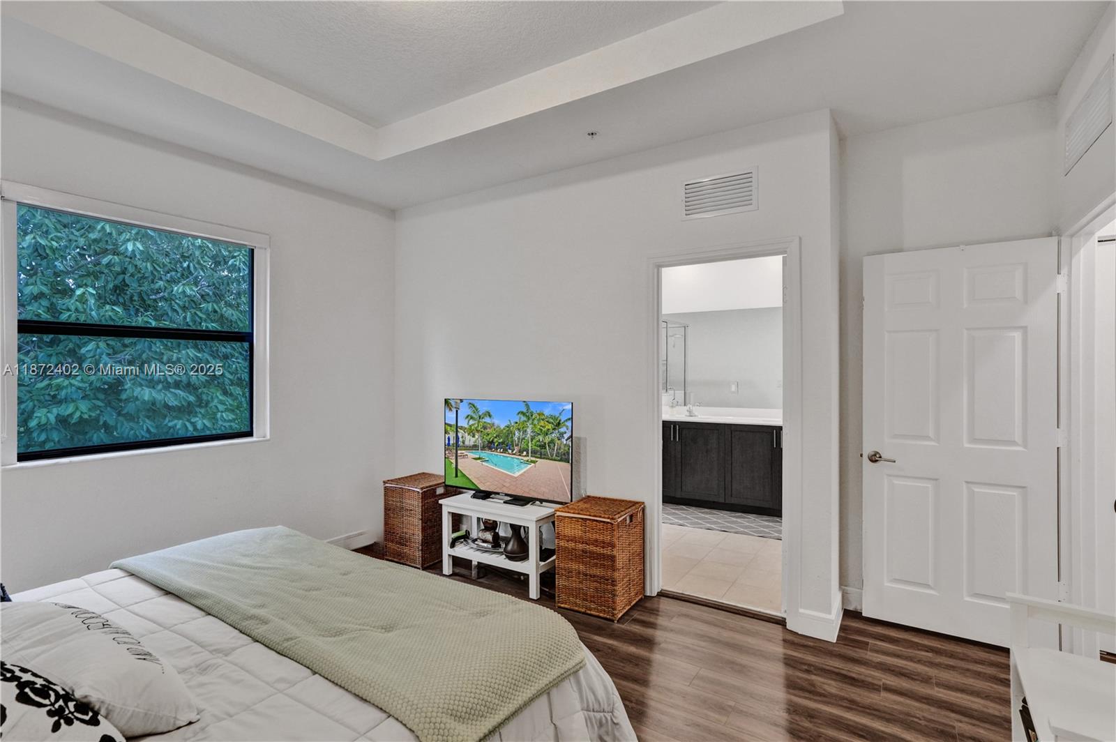 136 Southwest 185th Way Pembroke Pines, FL 33029 - Photo 25 of 48 a bedroom with a bed and a window