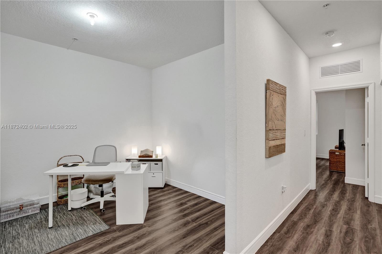 136 Southwest 185th Way Pembroke Pines, FL 33029 - Photo 30 of 48 a workspace with furniture and wooden floor