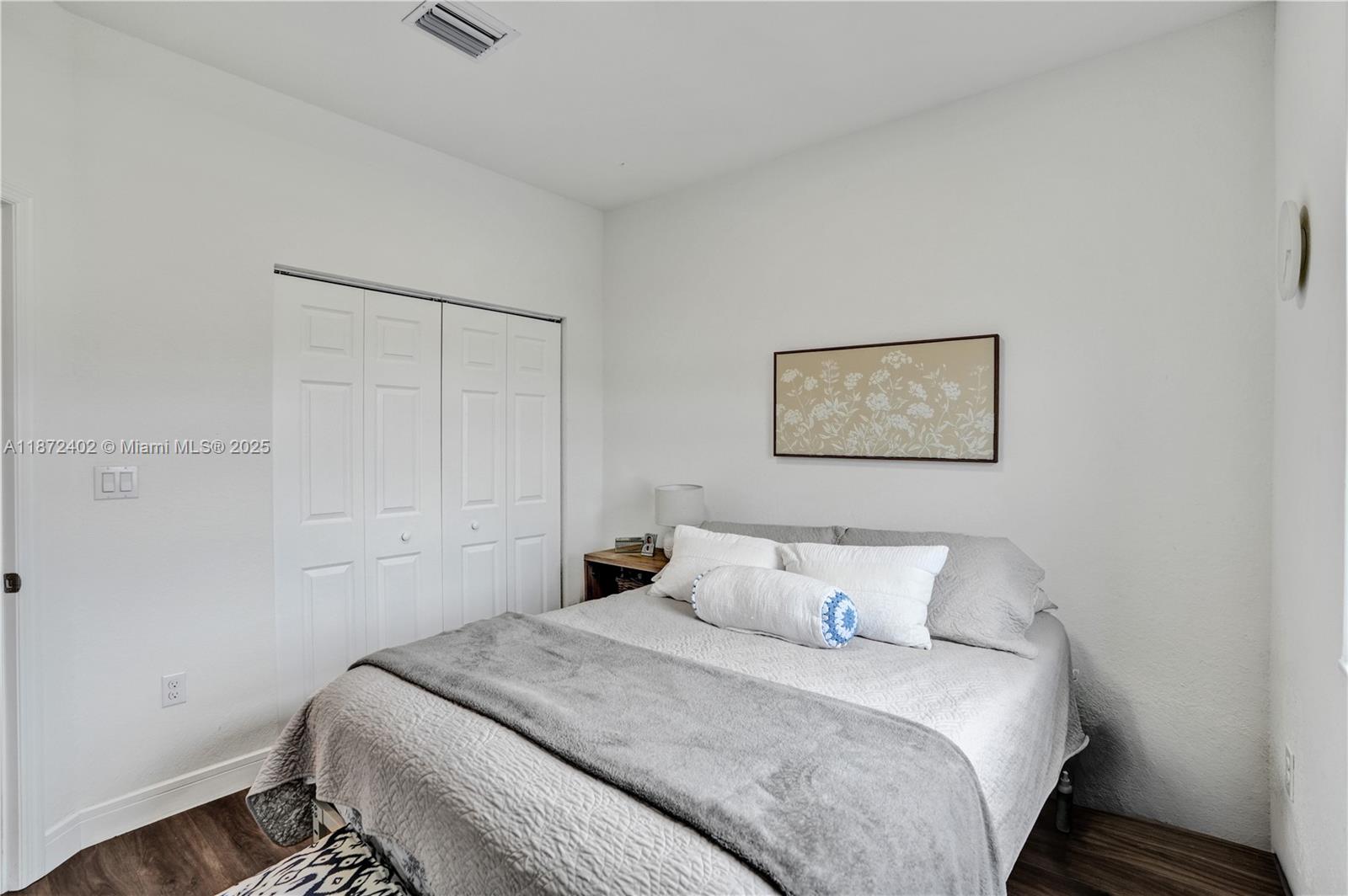 136 Southwest 185th Way Pembroke Pines, FL 33029 - Photo 34 of 48 a bedroom with a bed and a wall painting