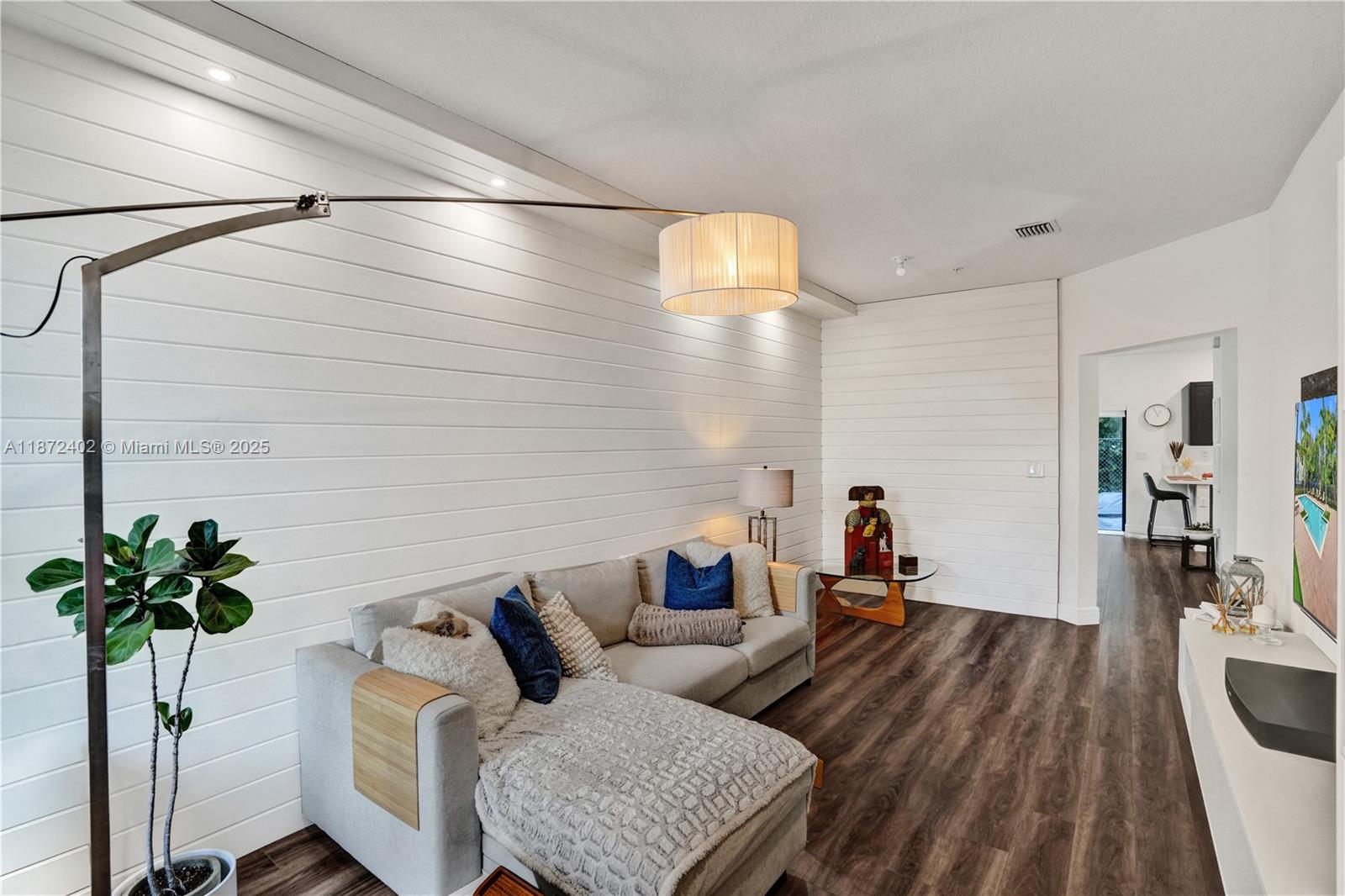 136 Southwest 185th Way Pembroke Pines, FL 33029 - Photo 7 of 48 a living room with furniture and a potted plant