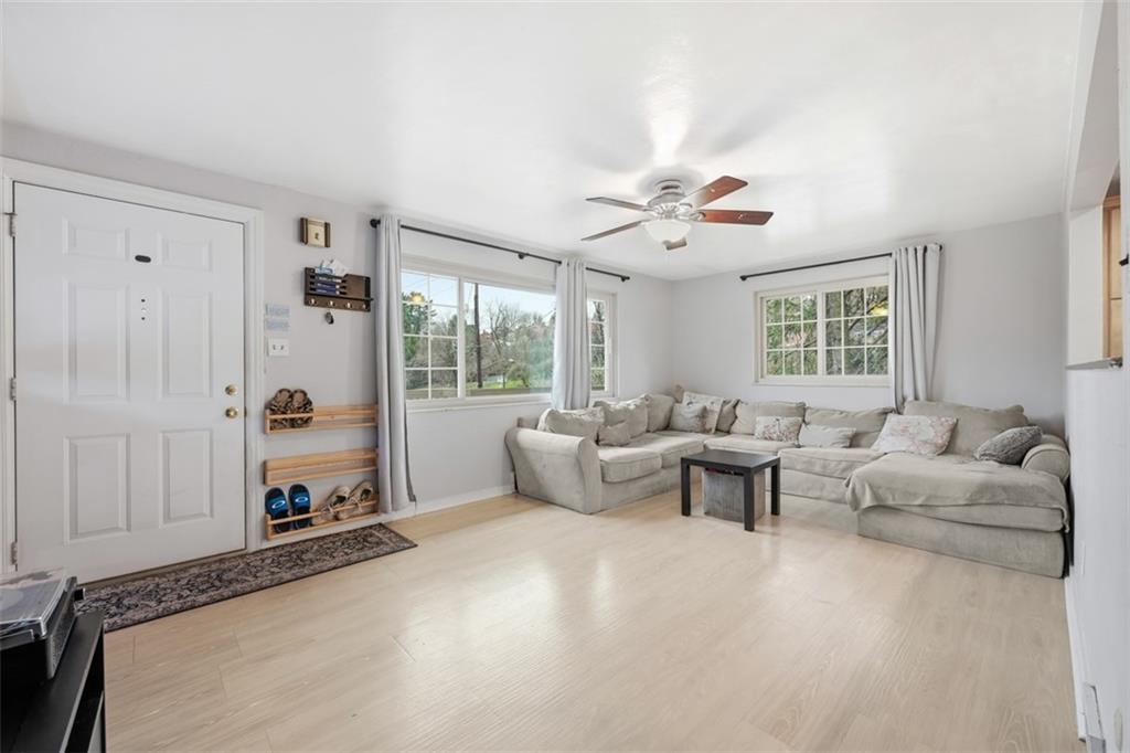2386 Crestview Road Pittsburgh, PA 15216 - Photo 11 of 48 a living room with furniture ceiling fan and a window