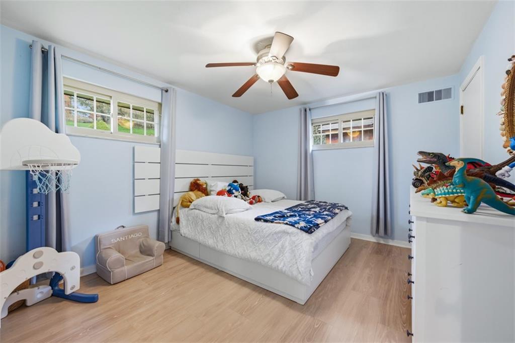 2386 Crestview Road Pittsburgh, PA 15216 - Photo 21 of 48 a bedroom with a bed and a chandelier