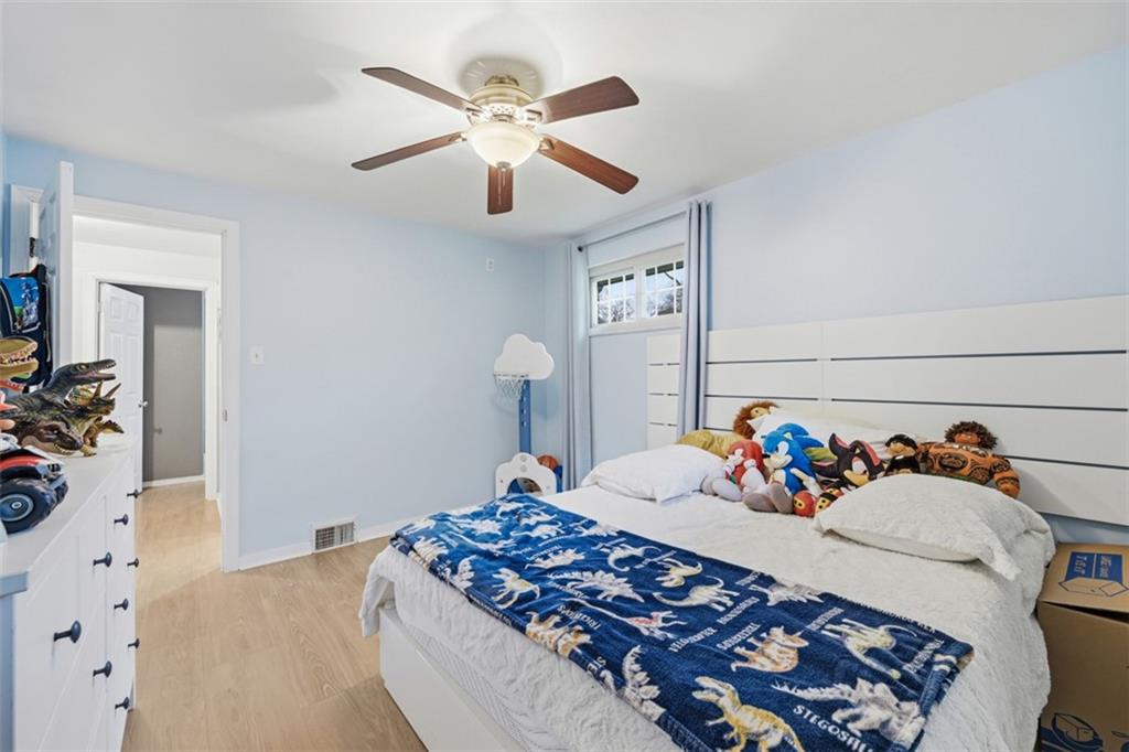 2386 Crestview Road Pittsburgh, PA 15216 - Photo 22 of 48 a bedroom with a bed and a chandelier