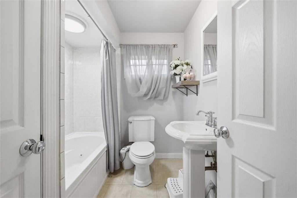 2386 Crestview Road Pittsburgh, PA 15216 - Photo 24 of 48 a bathroom with a toilet a sink and mirror