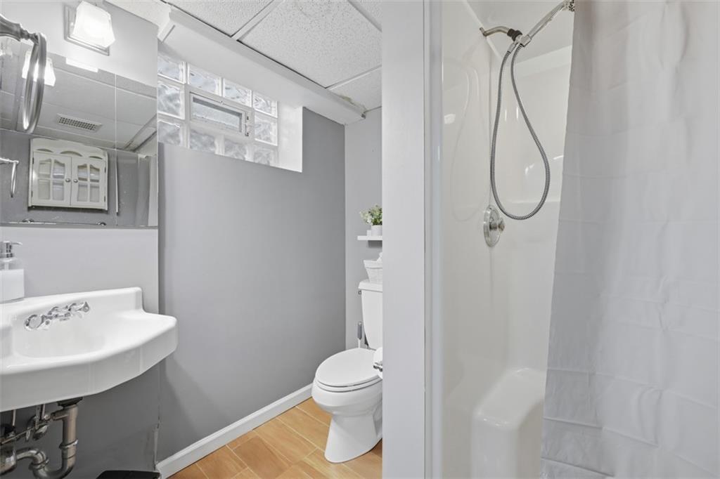 2386 Crestview Road Pittsburgh, PA 15216 - Photo 29 of 48 a bathroom with a granite countertop sink toilet and shower