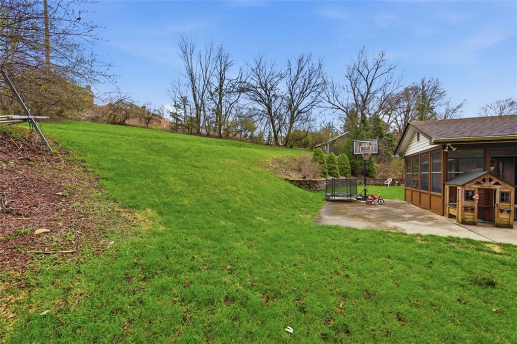 2386 Crestview Road Pittsburgh, PA 15216 - Photo 39 of 48 a view of a park with swings and slides