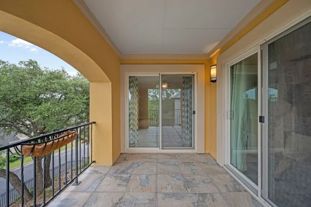 a view of a glass door with a porch