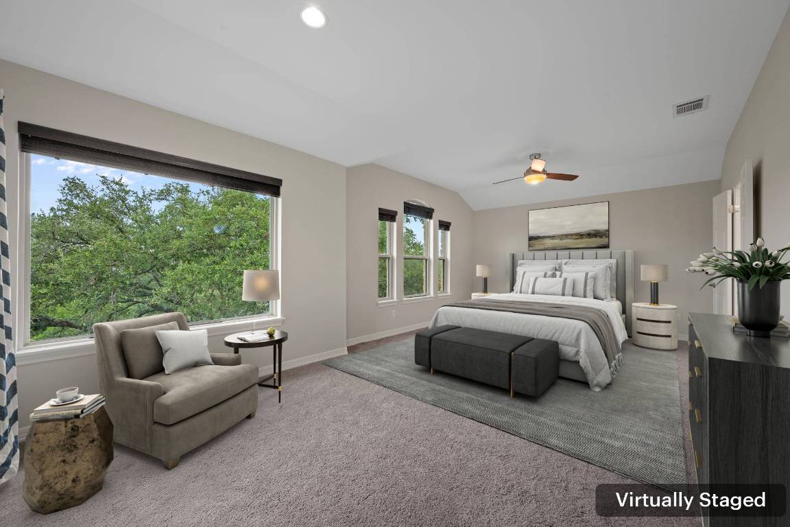 5715 Misty Hill Cove Austin, TX 78759 - Photo 19 of 40 a spacious bedroom with a bed and large windows
