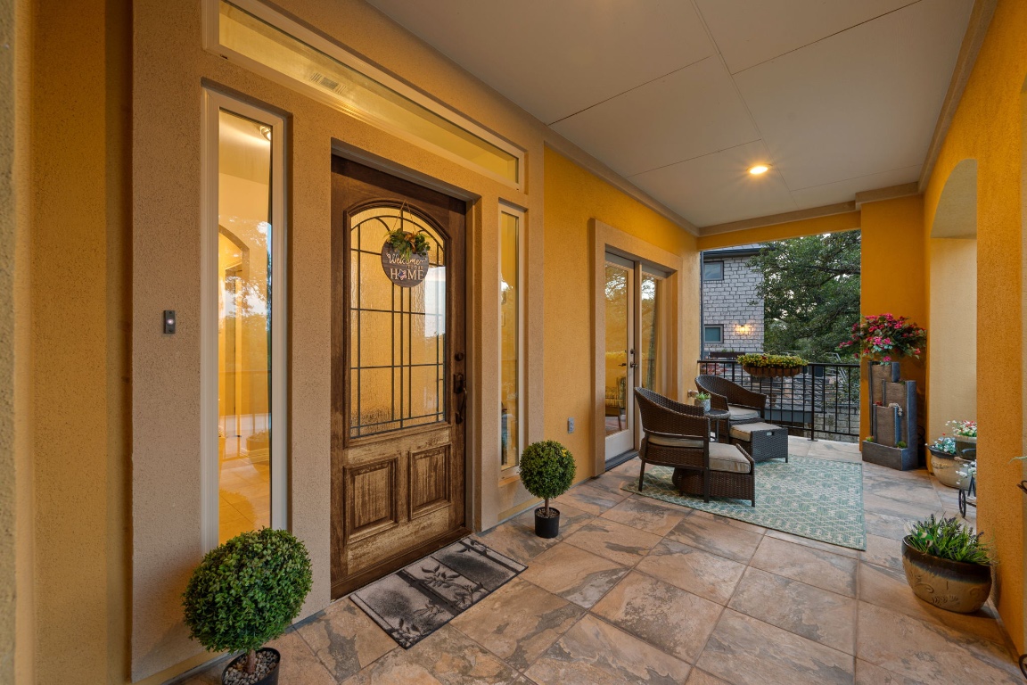 5715 Misty Hill Cove Austin, TX 78759 - Photo 3 of 40 a view of a entryway door couch and chairs in the patio