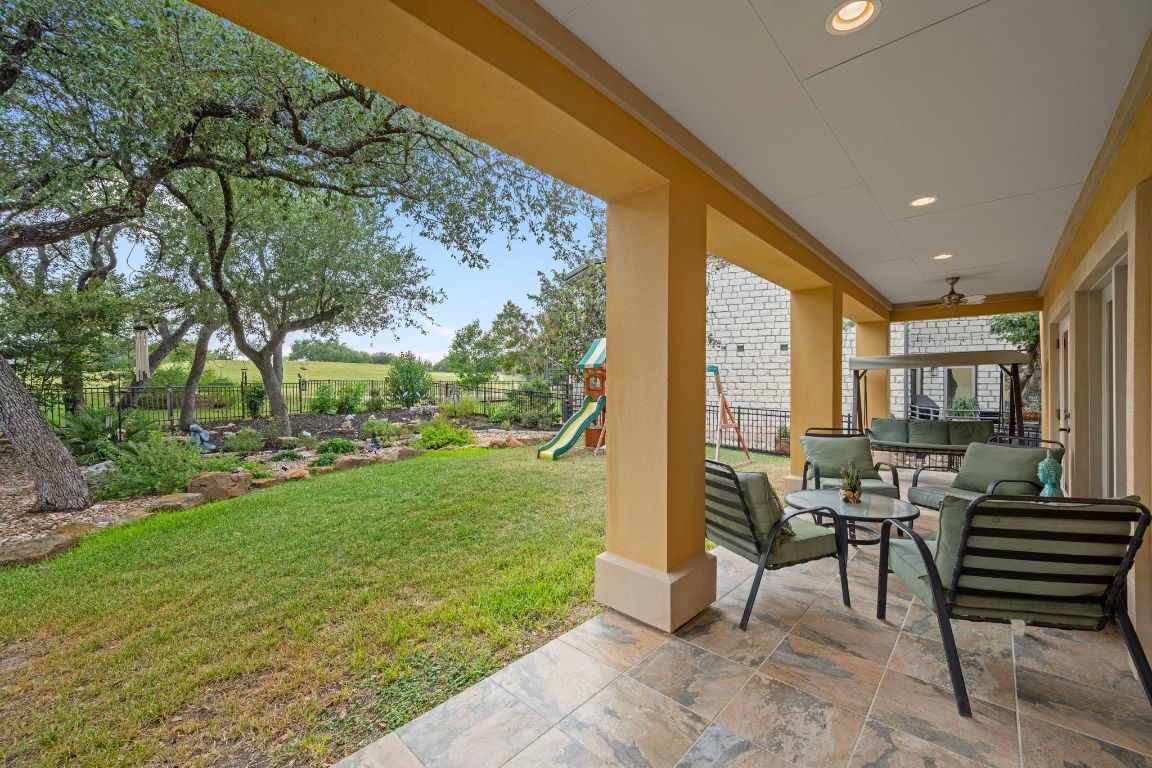 5715 Misty Hill Cove Austin, TX 78759 - Photo 32 of 40 a building outdoor space with patio furniture and garden
