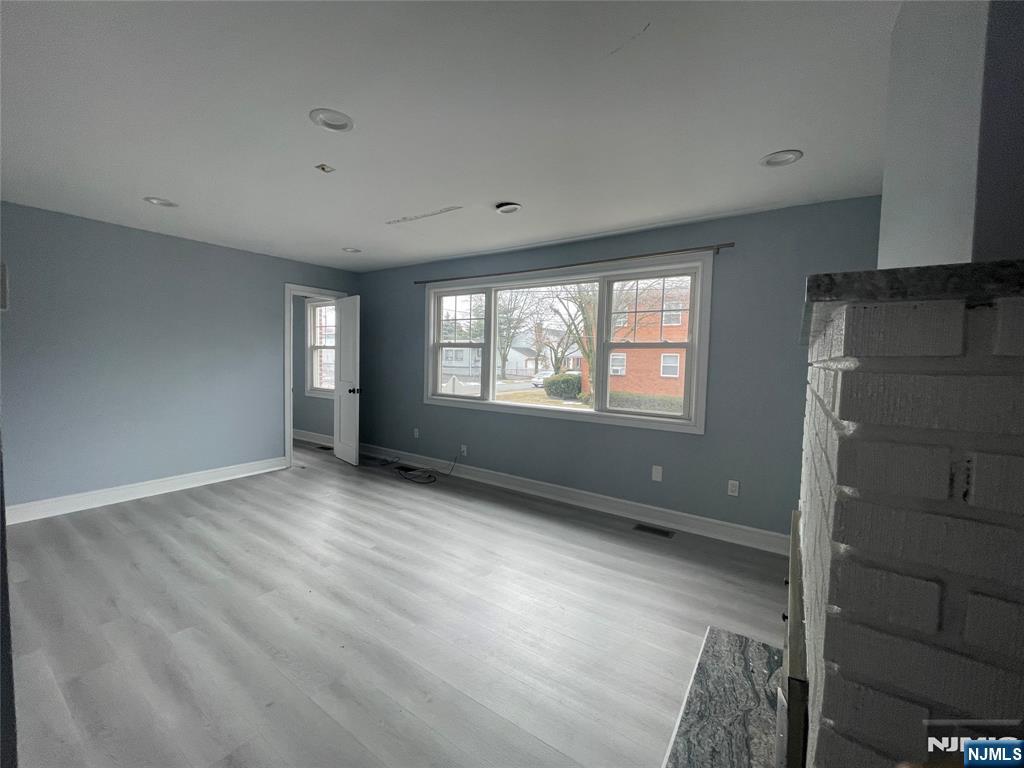 35 Chestnut Street, Unit 1F Wallington, NJ 07057 - Photo 3 of 9 a view of an empty room with a window