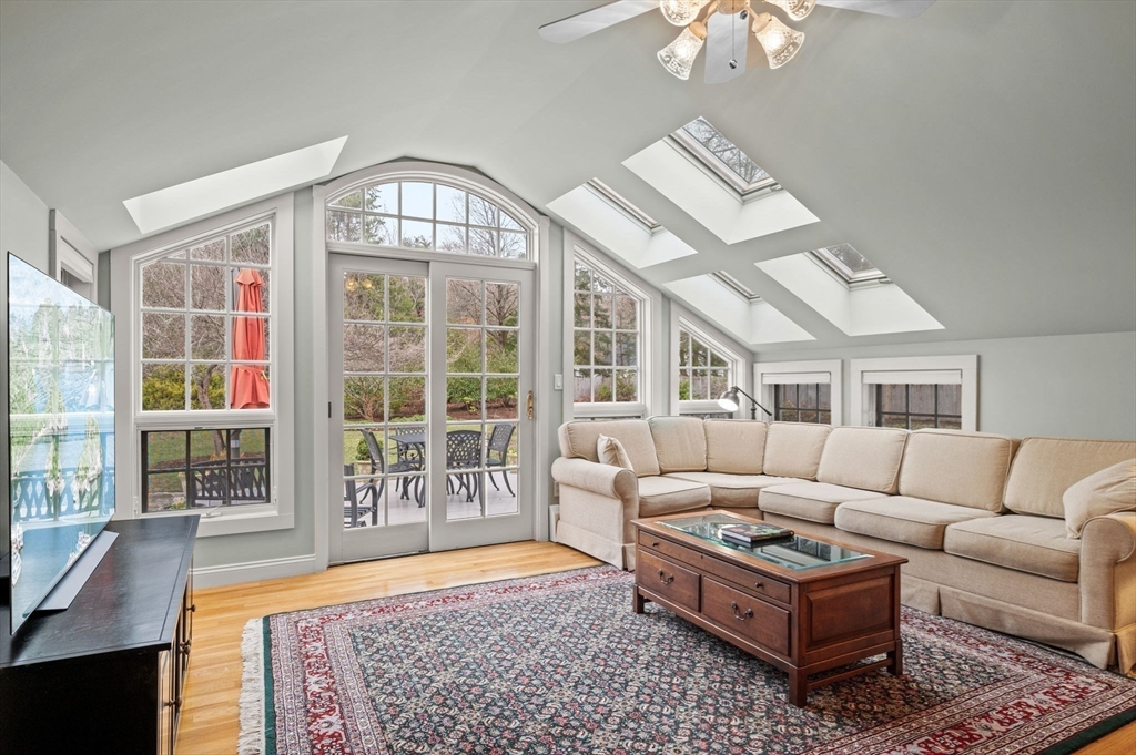16 Warner Road Ipswich, MA 01938 - Photo 6 of 42 a living room with furniture and a floor to ceiling window
