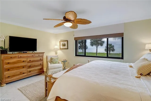 a bathroom with a shower a toilet and sink