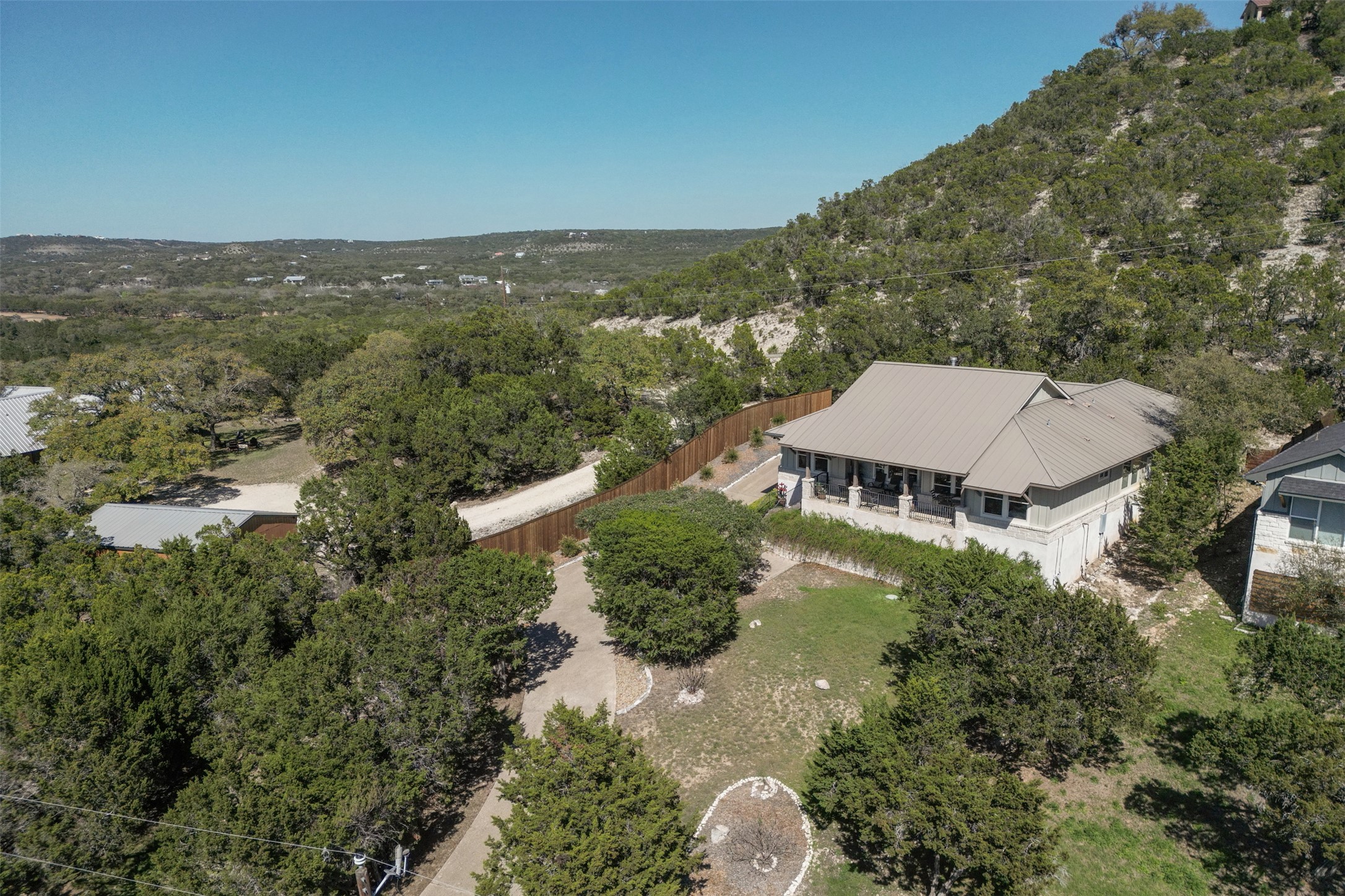 261 Barber Drive Wimberley, TX 78676 - Photo 28 of 37 Aerial view of property and surrounding area with a heavily wooded area