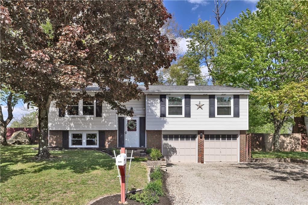 645 Blue Ridge Road Pittsburgh, PA 15239 - Photo 1 of 27 a front view of a house with a garden