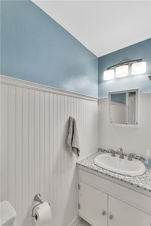 645 Blue Ridge Road Pittsburgh, PA 15239 - Photo 11 of 27 a bathroom with a granite countertop sink and a mirror